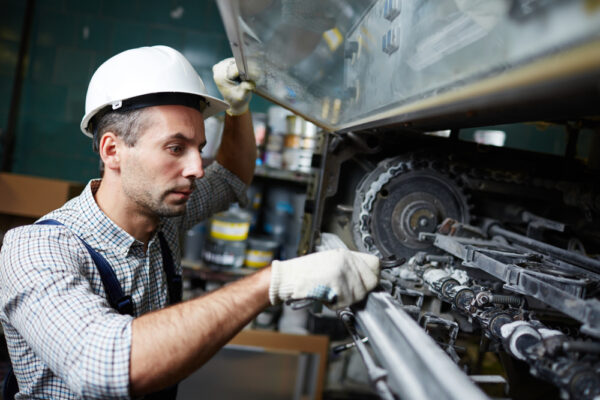 Man doing industrial machinery repair